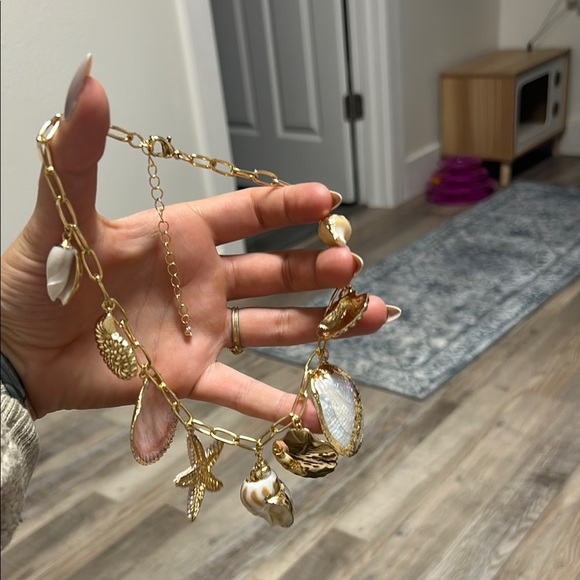 Gold Coastal Charm Necklace with Seashell and Starfish Designs - Picture 8 of 10